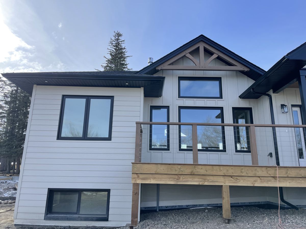 Eavestrough installation on a Peace Region home