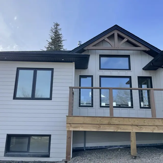 Eavestrough installation on a Peace Region home