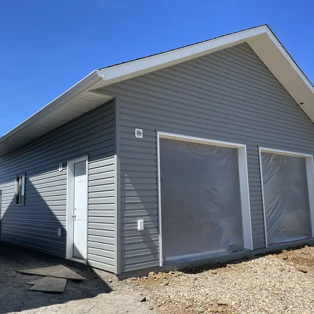 Eavestrough and downspout system on a residential property in northern BC